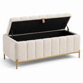 Panca contenitore in tessuto beige con gambe in metallo dorato